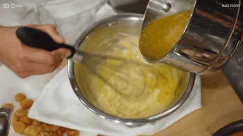 Egg Yolk Water Pouring On Dry Ingredients GIF