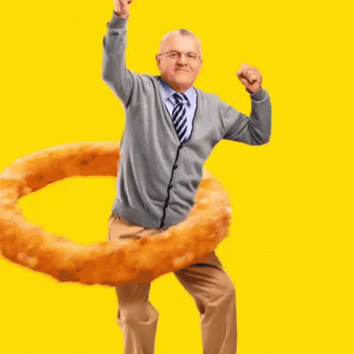 Elderly Man Dancing With Onion Ring