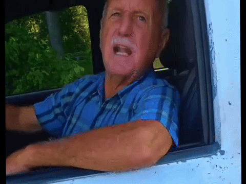 Elderly Man in Blue Plaid Shirt Shouting