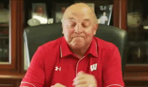 Elderly Man in Red Shirt With Letter W