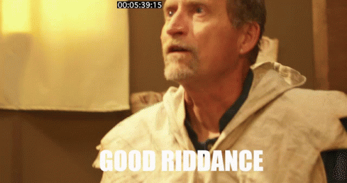 Elderly Man In Striped Apron Looking At Camera GIF