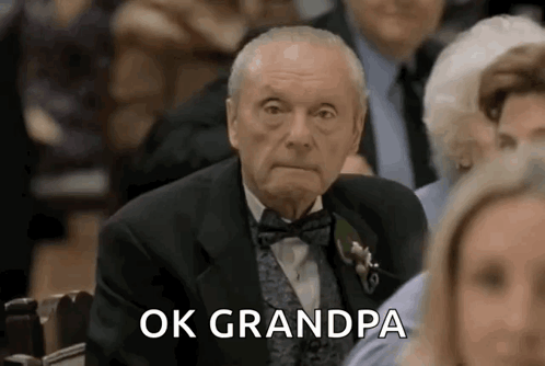 Elderly Man In Tuxedo Sitting GIF
