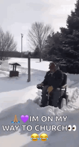 Elderly Man in Wheelchair Driving Through Snow
