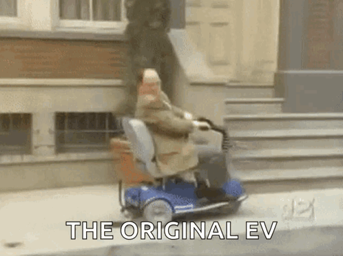 Elderly Man Riding Mobility Scooter