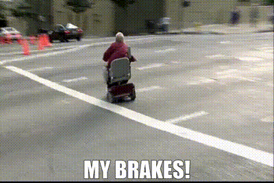 Elderly Man Riding Mobility Scooter