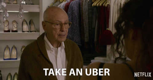 Elderly Man Talking to Woman About Uber