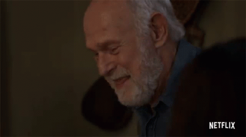 Elderly Man With Beard Hands on Forehead