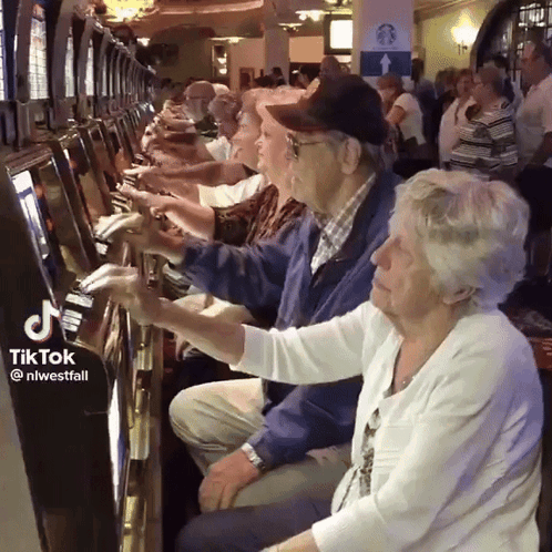 Elderly People Playing Video Game At Casino GIF