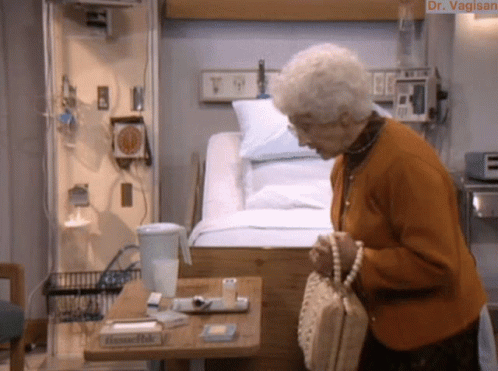 Elderly Woman at Hospital Bed With Tissues