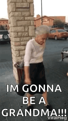 Elderly Woman Dancing on Sidewalk by Brick Building