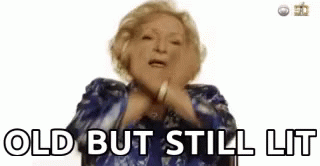 Elderly Woman in Blue Jacket Saying Old But Still Lit