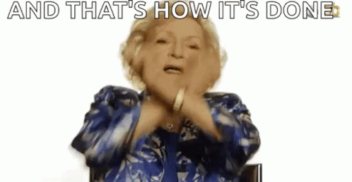 Elderly Woman in Blue Shirt Saying And That's How It's Done