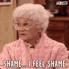 Elderly Woman in Pink Robe Says Shame I Feel Shame