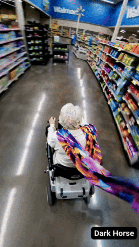 Elderly Woman in Wheelchair Walking