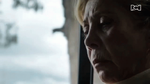 Elderly Woman Looking Out Window Eyes Closed
