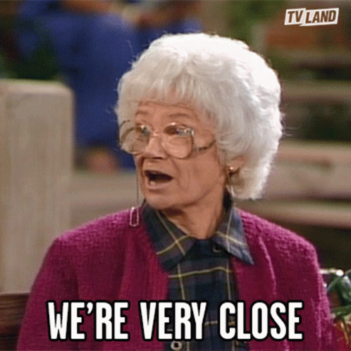 Elderly Woman Purple Sweater Says We're Very Close