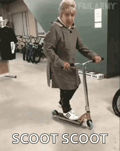 Elderly Woman Riding Scooter