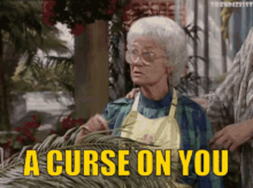 Elderly Woman Saying Curse on You in Yellow
