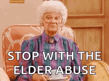 Elderly Woman Sitting With Tea And Coffee GIF
