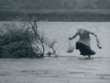 Elderly Woman Walking on Frozen Lake