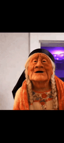 Elderly Woman Wearing Native American Mask