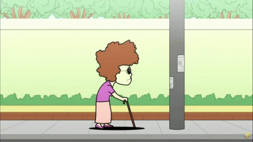 Elderly Woman With Cane Next to Pole