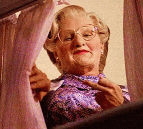 Elderly Woman With Glasses Looking Out Window
