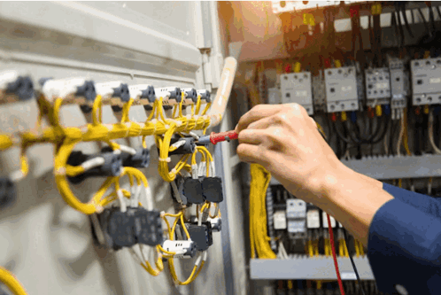Electrician Working On Circuit Board With Multimeter GIF