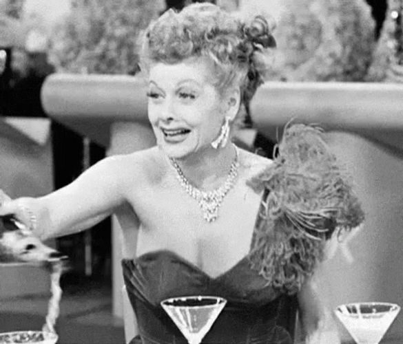 Elegant Lucille Ball Champagne Popping GIF