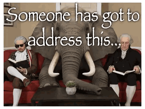 Elephant Sitting on Couch Next to Men Reading