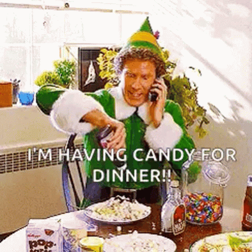 Elf Man Talking On Cell Phone At Table GIF