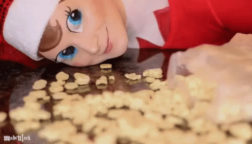 Elf On The Shelf Moving Licking Cereals GIF