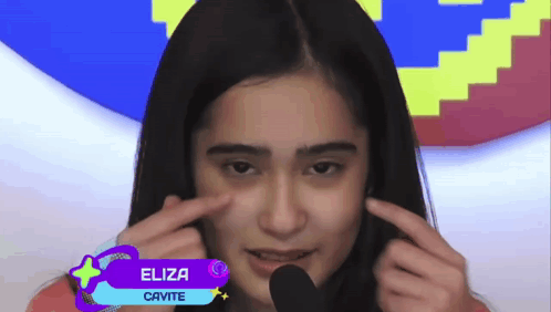 Eliza Cavite Making Face at Microphone