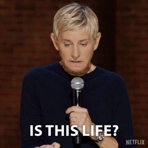 Ellen Degeneres Is Holding A Shure Microphone And Says " Is This Life " GIF