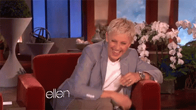 Ellen Degeneres Is Laughing While Sitting In A Chair On A Television Show . GIF
