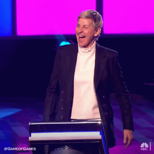 Ellen Degeneres Is Laughing While Standing At A Podium For Game Of Games On Nbc GIF