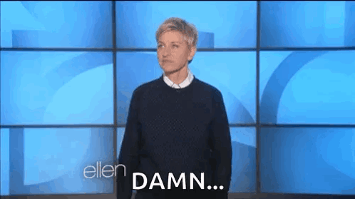 Ellen Degeneres Making Face Against Blue Wall