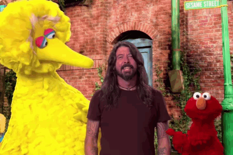 Elmo And Big Bird Are Standing Next To A Man In Front Of Sesame Street GIF