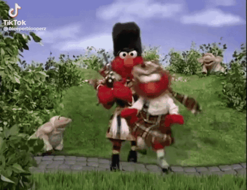 Elmo Dancing With His Friend In The Garden GIF