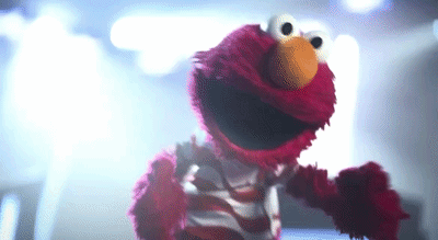 Elmo From Sesame Street Dancing in Striped Shirt