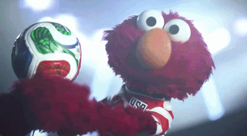 Elmo from Sesame Street Holding Soccer Ball