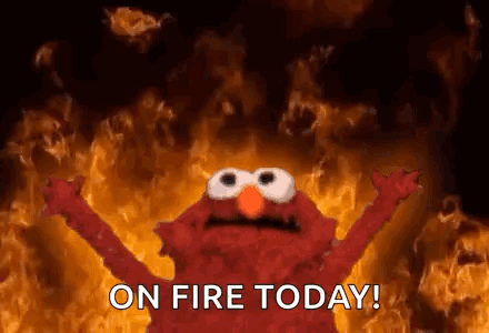 Elmo from Sesame Street in Front of Fire Wall