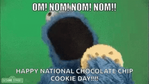 Elmo From Sesame Street Is Eating A Chocolate Chip Cookie . GIF