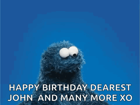 Elmo From Sesame Street Is Holding A Red Heart And Wishing John And Many More Xo . GIF
