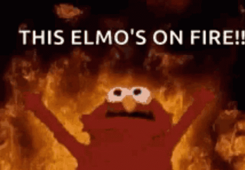 Elmo From Sesame Street Is On Fire With His Arms Outstretched GIF