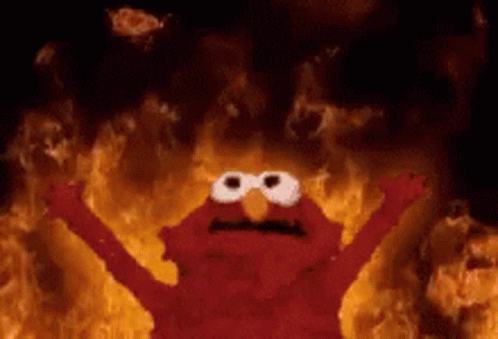 Elmo From Sesame Street Is On Fire With His Arms Outstretched GIF