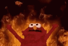 Elmo From Sesame Street Is On Fire With His Arms Outstretched And His Eyes Closed . GIF
