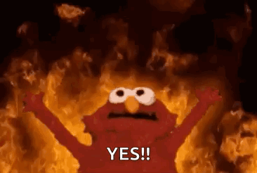 Elmo From Sesame Street Is On Fire With His Arms Outstretched And Says Yes . GIF