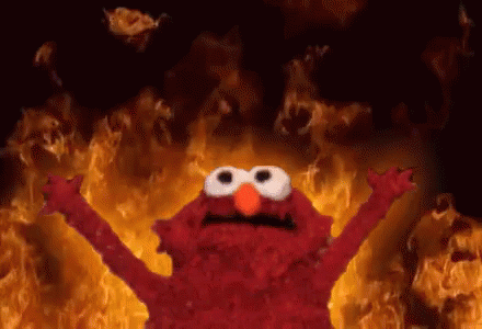 Elmo From Sesame Street Is On Fire With His Arms Outstretched GIF