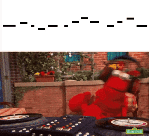 Elmo From Sesame Street Is Playing A Game With A Roulette Wheel GIF